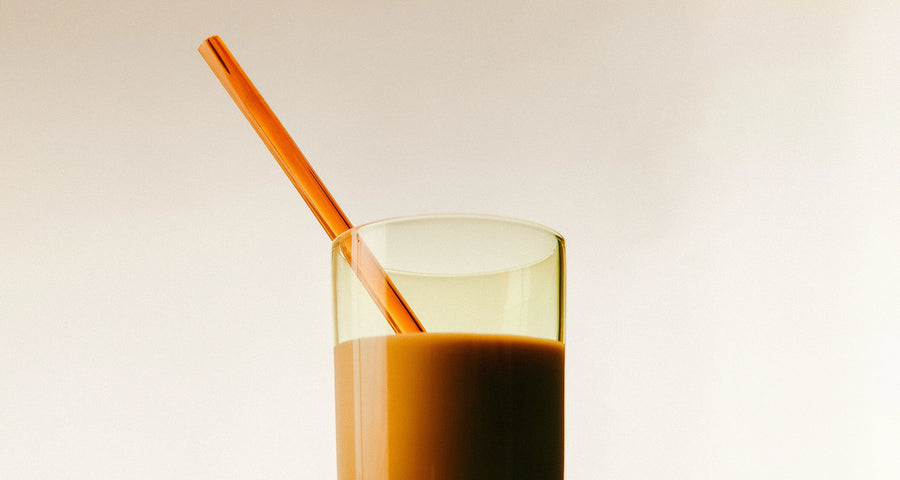 Vanilla latte with orange straw